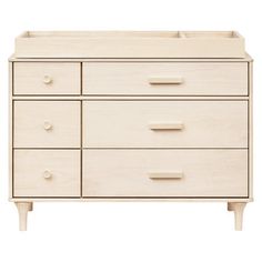 a white dresser with drawers and handles on it