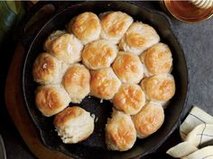 a cast iron skillet filled with biscuits