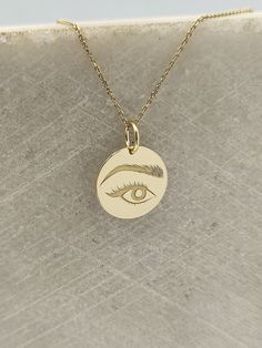 Eye Necklace - Engraved Woman Eye Charm - Gold Eye Charm - Gold Eye Pendant ▪️ A beautiful and clean engraved Woman Eye pendant made out of 14K Solid Real Gold. Available only in yellow gold! Pendant Thickness: 0.50mm Jump Ring inner diameter: 4mm Dimensions: - 13mm / 0.52 inches - 15mm / 0.59 inches - 18mm / 0.70 inches - 20mm / 0.78 inches - 22mm / 0.86 inches - 24mm / 0.94 inches Necklace Length - You can choose your chain length from 35CM to 50CM. The pendant is available alone without a cha Laser Engraved Symbolic Round Jewelry, Laser Engraved Round Yellow Gold Necklace, Solid Gold Necklace, Gold Eyes, Eye Pendant, Coin Necklace, Eye Necklace, Gold Coins, Real Gold