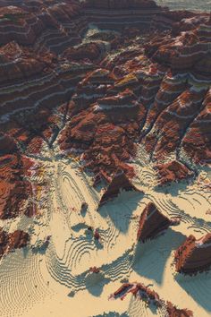 an aerial view of some rocks and sand