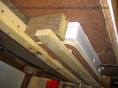 some wood beams are attached to the ceiling