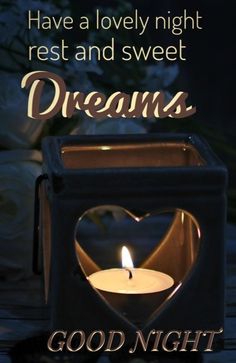 a candle that is in the shape of a heart with words above it and an image of