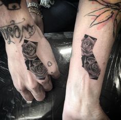 two people with matching tattoos on their hands