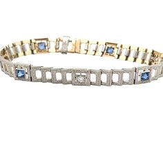 This gorgeous 1920's sapphire and diamond bracelet features .40ct of sapphires and .25ct of diamonds. The bracelet has a beautifully engraved platinum top and a 14k yellow gold back. This bracelet measures 7.25 inches. B4867 --Please reference our policy for more details before purchase-- For International orders, please provide a phone number for shipping purposes. Just place a note in the comment box during check out.Thank you.** Art Deco Diamond Tennis Bracelet With Single Cut Diamonds, Art Deco Diamond Jubilee Bracelet, Art Deco Diamond Bracelet With Accents, Vintage Platinum Bracelets With Diamond Accents, Art Deco White Gold Diamond Bracelet, Art Deco White Gold Bracelets With Single Cut Diamonds, Vintage Tennis Bracelet With Single Cut Diamonds, Art Deco Diamond Jubilee Bracelet For Anniversary, Vintage Formal Tennis Bracelet With Single Cut Diamonds