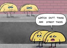 three yellow tacos standing in front of a brick wall, one saying watch out those are street tacos