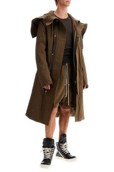 Find RICK OWENS Oversized Park on Editorialist. The Rock Owens parka is made of a cotton blend fabric and features oversized volumes and an oversized fit. It has a hidden zip closure with snap buttons, a drawstring hood, and a lightly padded and lined interior with two zip pockets. It also includes flap pockets and two patch pockets. The model is 187 cm tall and wears size IT 48. Oversized Cotton Parka For Fall, Cotton Long Coat Parka For Spring, Cotton Long Parka For Spring, Spring Cotton Long Coat Parka, Oversized Cotton Parka Long Coat, Oversized Cotton Parka With Pockets, Oversized Khaki Parka For Spring, Oversized Khaki Cotton Parka, Urban Oversized Parka With Pockets