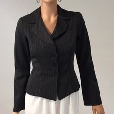 Wrapper Black Pinstriped Blazer Top With 3 Button Front And Shoulder Pads. No Pockets. Original Price $44.00 Armpit To Armpit Is 18’ Length Is 21” Fitted Long Sleeve Blazer With Buttons, Black Office Blazer With Buttons, Black Fitted Outerwear With Single Button, Fitted Black Outerwear With Single Button, Fitted Outerwear With Buttons For Business Casual, Fitted Business Casual Outerwear With Buttons, Black Blazer With Snap Buttons For Office, Formal Fitted Blazer With Snap Buttons, Black Office Blazer With Snap Buttons