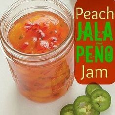 there is a jar of jalapeno jam next to some green peppers