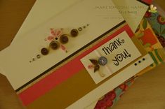 a thank you card with some buttons on it