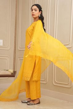 Mustard yellow cutwork kurta with floral resham, thread work, sequins, and beads embroidery. Paired with coordinating dupatta and pant. - Aza Fashions Designer Yellow Lawn Suit With Traditional Drape, Yellow Sets With Chikankari Embroidery For Summer, Yellow Chikankari Embroidery Sets For Summer, Fitted Yellow Salwar Kameez With Sheer Dupatta, Fitted Yellow Kurta With Sheer Dupatta, Yellow Cotton Sets With Sheer Dupatta, Yellow Chanderi Unstitched Suit With Sheer Dupatta, Yellow Lawn Suit With Traditional Drape For Diwali, Yellow Chikankari Embroidery Salwar Kameez