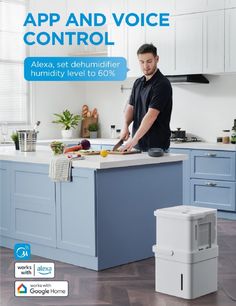 a man standing in front of a kitchen counter with an appliance on it