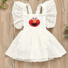 a white dress with an elm sesame character on it