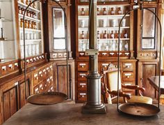 an old fashioned pharmacy cabinet with medicine bottles on the shelves