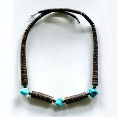 Vintage Santo Domingo Heishi Necklace W/ Sterling Navajo Pearls & “Kingman” Turquoise No Markings Tested As Sterling Silver Verified Kingman Turquoise Wire Strung Length ~ 18” Total Weight ~ 23.8 Grams 6 Sterling Silver Navajo Pearls ~ 4mm Heishi Beads 3mm - 10mm 3 Turquoise Stones ~ 10 X 10 X 10mm Kewa Santo Domingo Jewelry Pueblo Jewelers, Following Ancestral Tradition, Make Disk-Bead Necklaces That Rival Or Exceed The Fineness Of Ancient Beadwork. Heishi, The Kewa Word For Shell, Has Become The Commonly Used Term For This Type Of Jewelry. Handmade Hand Tooled Silver Made In The Usa Aboriginal Native American Wearable Art Collectible Investment Legacy Jewelry Stat Artisan Turquoise Jewelry Fair Trade, Artisan Brown Turquoise Necklace Hand-strung, Heishi Necklace, Navajo Pearls, Jewelry Statement, Turquoise Stones, Kingman Turquoise, Heishi Beads, Vintage Brown