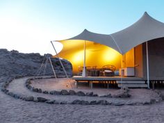 a large tent set up in the desert