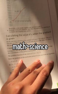 someone is holding their hand up in front of a paper with the word math science on it