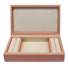 an open pink leather box with three rings in it on a white background, showing the inner compartments