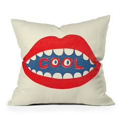 a pillow with the word cool on it's mouth and teeth in red, white, and blue