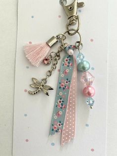 a key chain with some charms attached to it