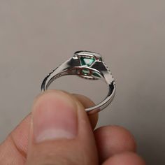 This is a gorgeous handmade creation. Its beauty is its simplicity & Elegance. The 7*7mm cushion cut lab emerald is crafted in sterling silver with rhodium plated. It's made to order and it will take about 7-10 days to make it. All item is sent in a beautiful gift box You can realize more lovely stuff clicking the link https://www.etsy.com/shop/knightjewelry?refshopsection_shophome_leftnav Please leave the correct address and you phone number for delivering successfully. Sterling Silver Emerald Ring Asscher Cut, White Gold Asscher Cut Ring For May Birthstone, Silver Emerald Halo Ring In Fine Jewelry Style, Asscher Cut Emerald Ring In Sterling Silver For Anniversary, Asscher Cut Emerald Ring With Halo Setting For Promise, Asscher Cut Emerald Jewelry With Halo Setting, Luxury Emerald Ring With Cushion Cut And Halo Setting, Silver Asscher Cut Emerald Jewelry, Emerald Asscher Cut Halo Setting Jewelry