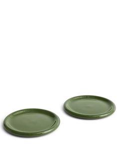 two green plates sitting next to each other