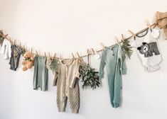 clothes hanging on a line with teddy bears and plants