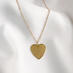 Gold-filled reversible heart pendant strung on dainty 14k gold-filled chain. Sweet alone, even better layered. Length: 18” delicate 14k gold-filled chain Pendant: 1” Handmade Lobster clasp Includes 100% organic cotton jewelry pouch Pairs perfectly with our Soulmate Toggle Bracelet This item is made to order and shipped with love from our studio located in West Chester, PA. *Click here to learn more about gold filled jewelry Gold Heart Necklace With Adjustable Chain, 14k Gold Filled, Adjustable 14k Gold-filled Heart Necklace, Dainty Gold-tone Heart Necklace, Gold Dainty Heart Necklace With Paperclip Chain, Dainty Gold Heart Necklace With Paperclip Chain, Gold-tone Heart Necklace With Delicate Chain, 14k Gold-filled Heart Necklace With Adjustable Chain, Everyday 14k Gold Filled Heart Necklace With Delicate Chain, 14k Gold Filled Necklaces For Everyday Valentine's Day