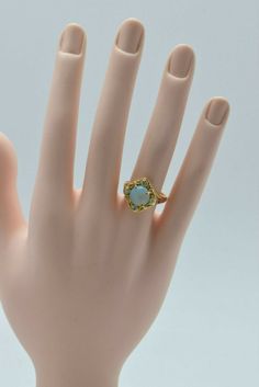 14K Yellow Gold Nice Crystal Opal and Diamond Ring, 4 diamonds round opal cub in center, 10 mm round blue green fire pinkish background opal, Ring size 8, 4.7 grams Stock # BB187R10 Most rings are sizable for a small fee. If the ring you are considering is the incorrect size contact us for a quote. This listing contains photographs of the actual item you will receive. Our items are in excellent condition with little or no signs of wear and many are one of a kind pre-owned estate finds. Please lo Pinkish Background, 1920s Ring, Opal And Diamond Ring, Opal Band, Green Fire, Crystal Opal, Art Deco Diamond, Fine Jewelry Designers, Boston Ma