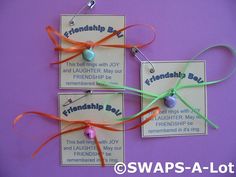 two tags with ribbons attached to them on a purple background that says, friendsday