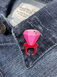 "The iconic, deliciously playful, wearable plastic ring with a large hard candy jewel now in miniature size! Perfect for the candy lover, and for some, even proposals! 1.5\" tall gold hard enamel pin Available in \"Blue Raspberry\" or \"Strawberry\" Double rubber pin back (Blue/Pink) All pins are fixed to a backing card and put in a clear bag to help get it safely to its new home. ------- B-grade pins also available! Almost perfect pins at a lower price! Imperfections are mostly slight scratches Pink Enamel Pin For Gifts, Pink Enamel Pins For Gifts, Pink Enamel Pins As Gifts, Pink Enamel Pins As Gift, Pink Brooch For Valentine's Day Gift, Pink Brooches For Valentine's Day Gift, Novelty Brooch Jewelry Gift, Pink Enamel Pin Brooch For Wedding, Ring Pops