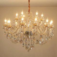 a chandelier hanging from the ceiling in a room