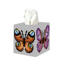 a tissue box with two butterflies on it