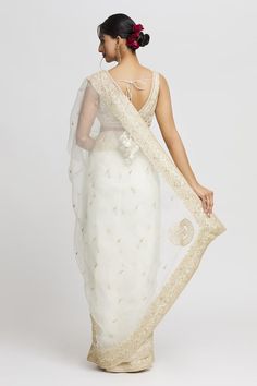 White organza saree with floral embroidered buttis and border. Comes with floral embroidered padded blouse. - Aza Fashions Transitional Organza Saree With Intricate Embroidery, White Organza Pre-draped Saree For Eid, Wedding Saree In Organza With Cutdana, Wedding Organza Saree With Cutdana, Organza Pre-draped Saree With Sheer Dupatta, Transitional Organza Pre-draped Saree With Dupatta, Transitional Pre-draped Organza Saree With Dupatta, White Pre-draped Saree With Dupatta In Organza, Reception Organza Traditional Wear With Chikankari Embroidery