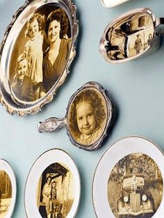 an assortment of antique photographs are displayed on the wall next to old fashioned plates and spoons