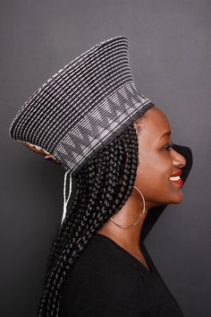 "In Zulu language \" Isicholo\" is a traditional hat made by rural women in South Africa. It was worn for special occasions but with the African fashion trending this hat can we worn for casual and formal events. The Zulu hat is handcrafted out of traditional cloth and set with patterns woven onto the fabric. It is available in a variety of colours. Dimension: H 15cm W 30cm L 30cm The hat has draw strings at the back to adjust the fit slightly. Each Zulu hat is an \"original\" work of art, indiv Traditional Handmade Black Hat Bands, Traditional Black Brimmed Hat, Traditional Black Hat One Size Fits Most, Zulu Language, Zulu Hat, Basket Hat, Zulu Wedding, African Crown, African Hat