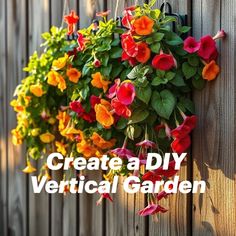 colorful flowers hanging from the side of a wooden fence with text create a diy vertical garden