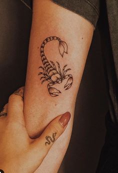 a woman's arm with a tattoo on it