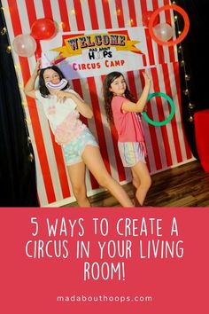 two girls standing in front of a circus tent