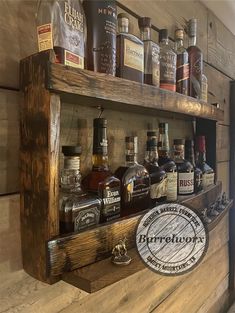 a wooden shelf filled with lots of bottles