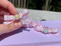 Your dog (or you!) will be looking so sweet in this adorable pink gingham bow, featuring a hand-painted pastel sprinkle design and an iridescent acrylic candy bead center. (bead color will be random) My clips are made with dogs specifically in mind, but are also perfect for babies, kids, and adults of all species. (as long as you have hair to attach them to, of course!)  All my products are designed, assembled, and decorated by me using quality materials and extra strong adhesive to ensure that Sprinkles Design, Babies Fashion, Iridescent Acrylic, Pastel Candy, Cosplay Kawaii, Handmade Hair Bows, Pink Gingham, Strong Adhesive, Claw Clip