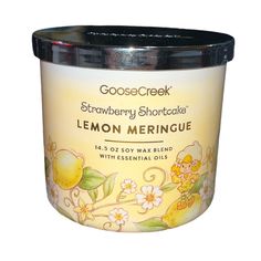 a jar of lemon meringue sits on a white surface with the words goose creek strawberry shortcakes