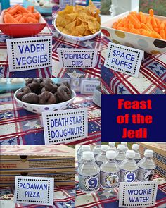 a table topped with lots of food and water bottles next to boxes filled with snacks