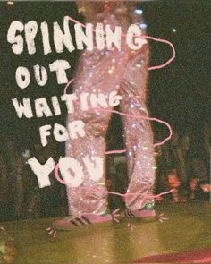 a person standing on top of a wooden floor in front of a sign that says spinning out waiting for you