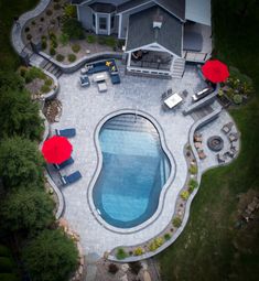 an aerial view of a pool and patio area