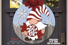 a christmas door hanger with the letter phi on it