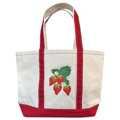 Strawberry design embroidered directly onto tote, in addition to embroidered accent on other side, located above external pocket. Tote features an external pocket, top zip closure, and an attached key ring. BiG Canvas Tote size: 12" H x 18" W x 5" D. Strap drop 9" Instructions for Custom Text: Type text exactly as you would like it to appear on tote. Available characters: upper and lowercase letters, numbers, spaces and ! # & " ? / ' . , @ ( ) +. 10 characters max. Important! Requests for person Strawberry Design, Music Machine, Utility Pouch, Upper And Lowercase Letters, Hey Good Lookin, Puff And Pass, Sale Store, Pocket Top, Mini Tote