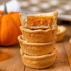 several pumpkin pies stacked on top of each other