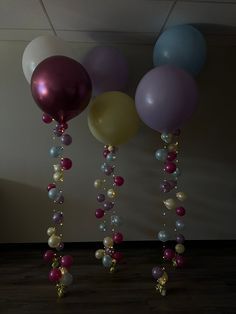 balloons and beads are hanging from the ceiling