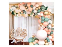 the balloon arch is decorated with pastel colors and greenery