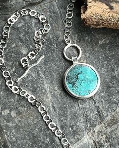 A show-stopping circle of natural Tibetan turquoise, set in a purpose made sterling and fine silver bezel, unbacked due to the shape and beauty of the back of the stone.  This necklace is all about the circles! the chain is a round, flat link trace style, and even my handmade round toggle clasp has curves in the fastener.  length of chain is 18" A unique, statement necklace.  The turquoise measures approx 2.5cm in diameter. All of my silver jewellery is sent beautifully wrapped and boxed in my h Unique Statement Necklace, Handcrafted Silver Jewelry, Tibetan Turquoise, Necklace Turquoise, Jewellery Gift, Turquoise Pendant, Toggle Clasp, Blue Moon, Silver Jewellery